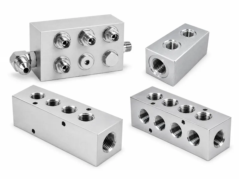 Hydraulic manifold block with multiple CNC-machined oil ports
