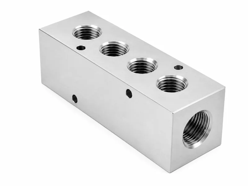 Hydraulic manifold block with multiple CNC-machined oil ports